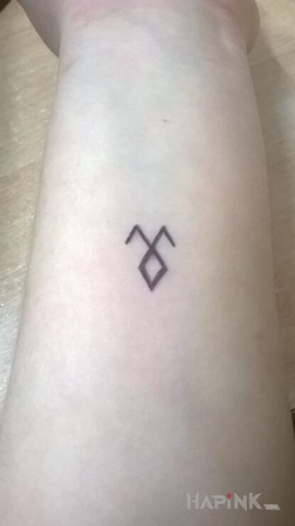 Tattoo Znak demona in demons motif on the forearm
