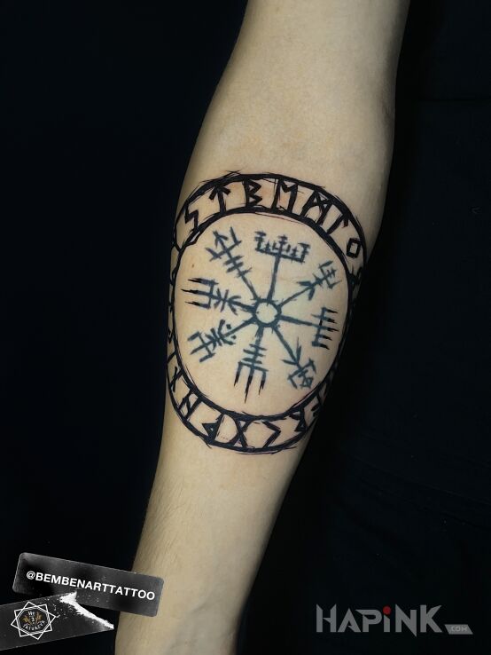 Tattoo Runes in black and gray motif and graphic / illustrative style On the arm