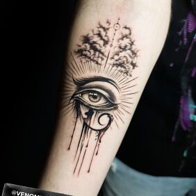 Tattoo Oko Horusa On the arm motif: religious style: graphic / illustrative