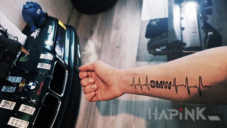 Tattoo Bmw in lettering motif on the forearm
