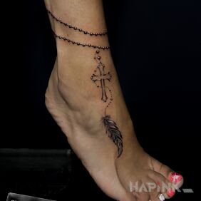 Tattoo Feather bracelet near the ankle motif: black and gray style: realistic