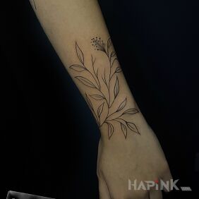 Tattoo Delicate Leaves on the forearm motif: floral style: minimalistic