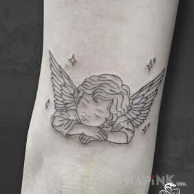Tattoo Sleeping Angel on the elbow motif: wings style: contour / linework