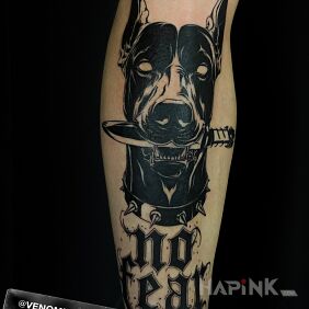 Tattoo Doberman on the tibia motif: black and gray style: graphic / illustrative