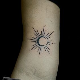 Tattoo Słońce i księżyc on the bicep motif: other style: minimalistic