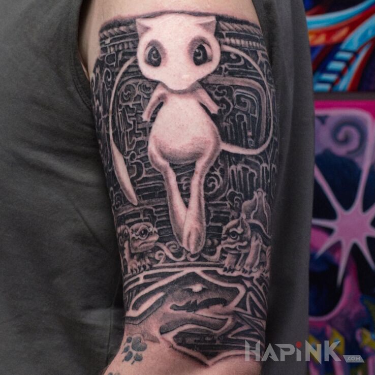 Tattoo Mew w otoczeniu starożytnych symboli i legend Pokémon in characters motif and graphic / illustrative style On the arm