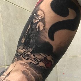 Tattoo Son :) on the upper arm motif: characters