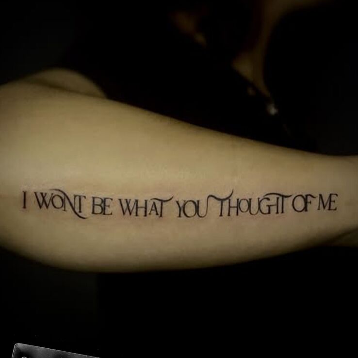 Tattoo Fragment piosenki Linkin Park in lettering motif and contour / linework style on the forearm
