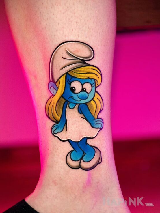 Tattoo Smurfette in color in characters motif and graphic / illustrative style near the ankle