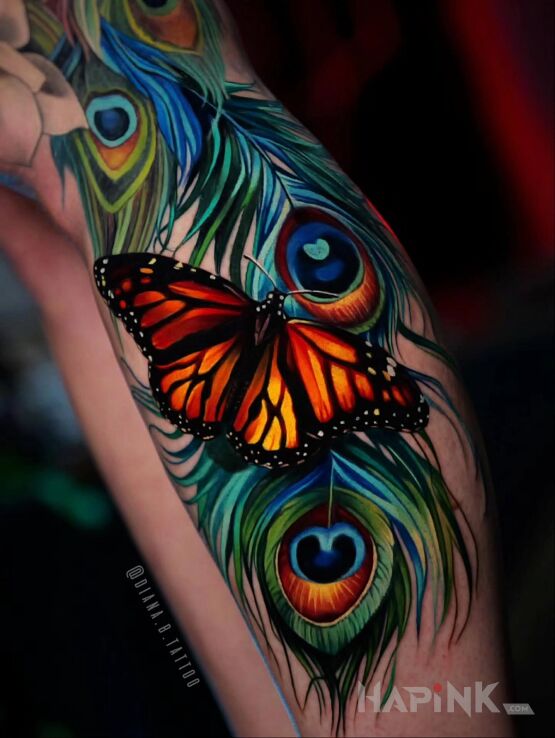 Tattoo Butterfly and peacock feather in intense colors in 3D motif and realistic style on the leg