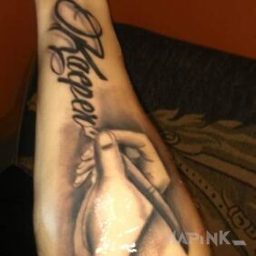 Tattoo Firstborn on the forearm motif: lettering