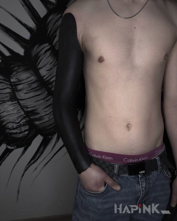 Tattoo Full arm blackout in black and gray motif and blackwork / blackout style On the arm