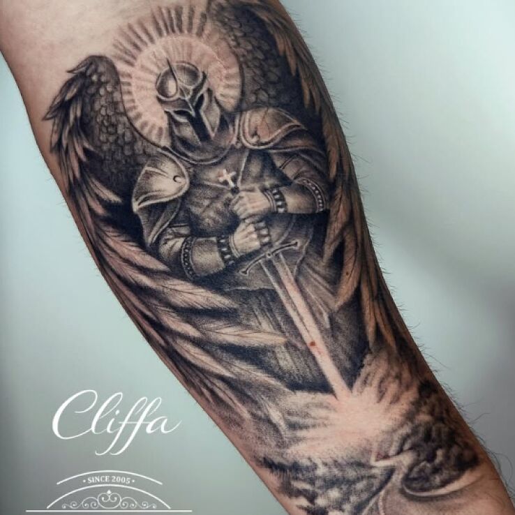 Tattoo Winged Warrior in wings motif and realistic style on the forearm