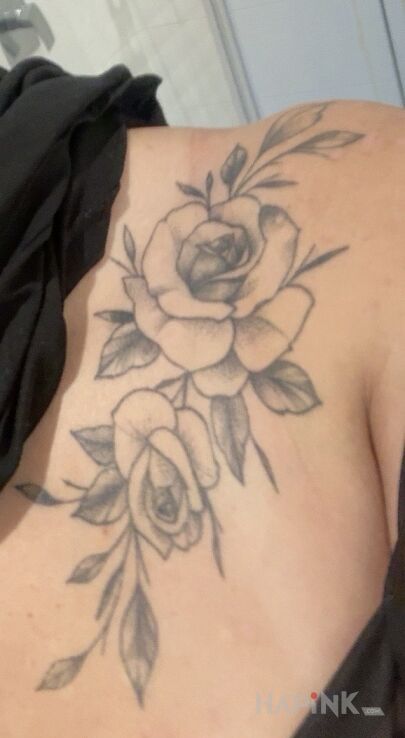 Tattoo I don't want these flowers, need a cover up in flowers motif and graphic / illustrative style on the collarbone