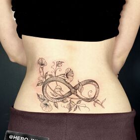 Tattoo Wąż on the back motif: flowers style: graphic / illustrative