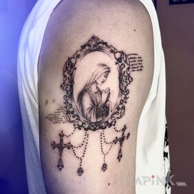 Tattoo Madonna in a Baroque Frame on the upper arm motif: ornaments style: dotwork