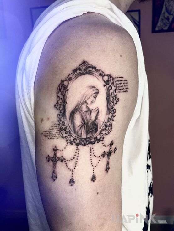 Tattoo Matka Boska w barokowej ramie in ornaments motif and graphic / illustrative style on the upper arm