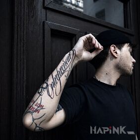 Tattoo Lettering done in cursive - entrepreneur on the forearm motif: lettering style: calligraphy