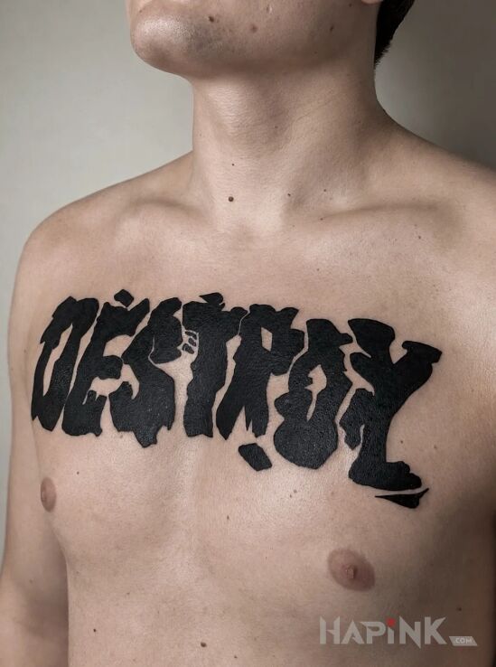 Tattoo Typographic slogan 'Destroy' in black and gray motif and blackwork / blackout style on the chest