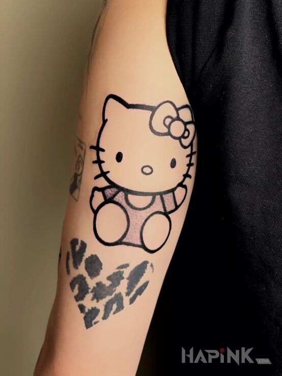 Tattoo Ikona popkultury w kropkach in manga / anime motif and cartoon / comic book style On the arm