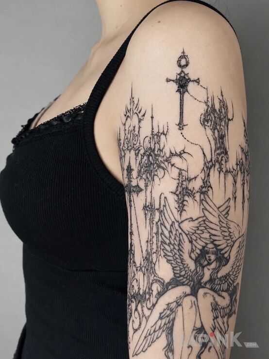Tattoo Gothic seraph and cathedral in religious motif on the upper arm