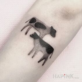 Tattoo Dwie kropkowane krówki On the arm motif: animals style: dotwork