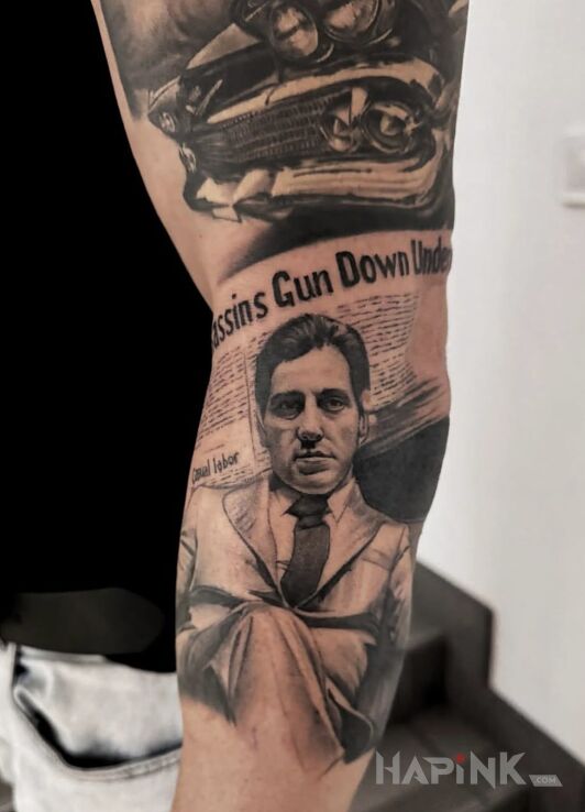 Tattoo Al Pacino — black & grey portrait in characters motif and realistic style on the forearm