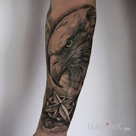 Tattoo Eagle and compass rose — black & grey on the forearm motif: animals style: realistic