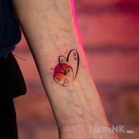 Tattoo Minimalist hearts with initials and a touch of color On the arm style: Watercolor