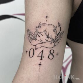 Tattoo Little angel with a devilish character. 😈🪽 on the bicep motif: angels style: minimalistic