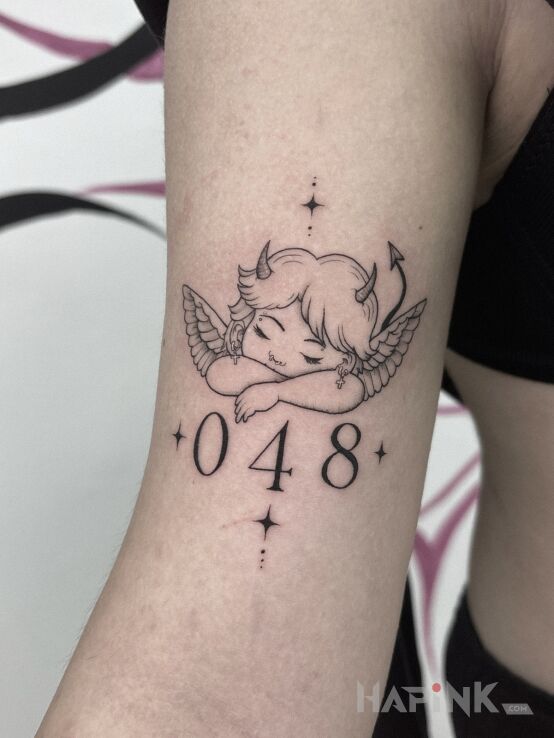 Tattoo Little angel with a devilish character. 😈🪽 in angels motif and contour / linework style On the arm