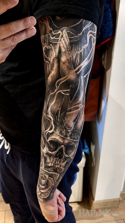 Tattoo Skull in a crown with a dollar rose in dark motif and realistic style On the arm