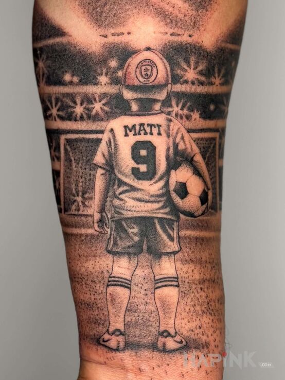 Tattoo Son in characters motif and realistic style On the arm