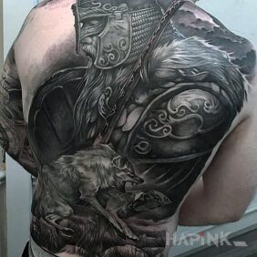Tattoo Warrior on the back motif: animals style: realistic