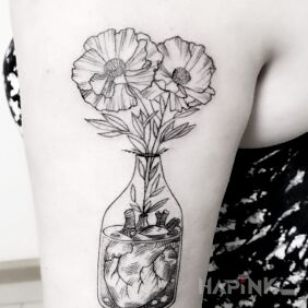 Tattoo Flowers in the heart on the upper arm motif: flowers