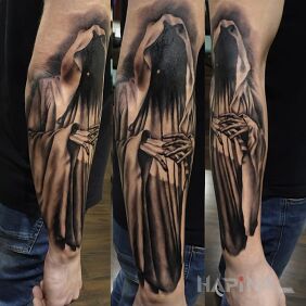 Tattoo Death on the forearm motif: characters