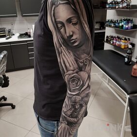 Tattoo Religious sleeve on the forearm motif: religious