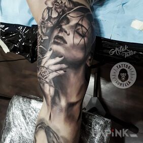 Tattoo Portrait on the upper arm motif: faces style: realistic