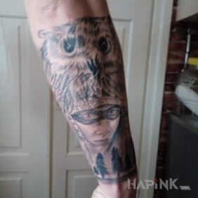 Tattoo Owl. Indjanka on the forearm motif: faces