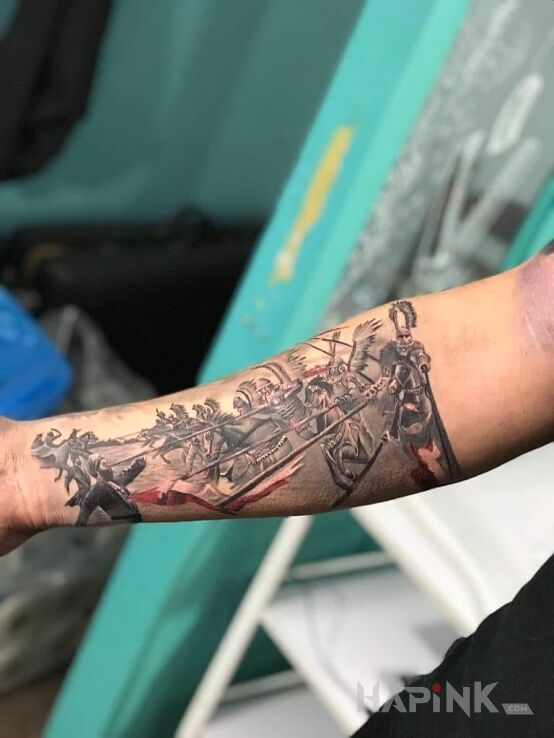 Tattoo C.D.N in patriotic motif on the forearm