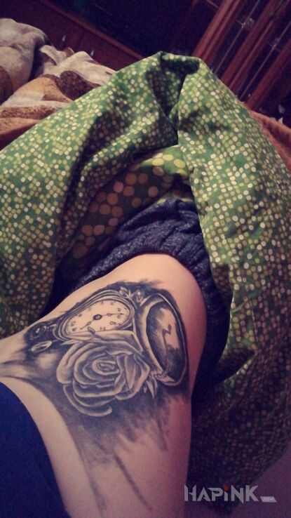Tattoo Zegar wraz z różą in flowers motif on the ribs