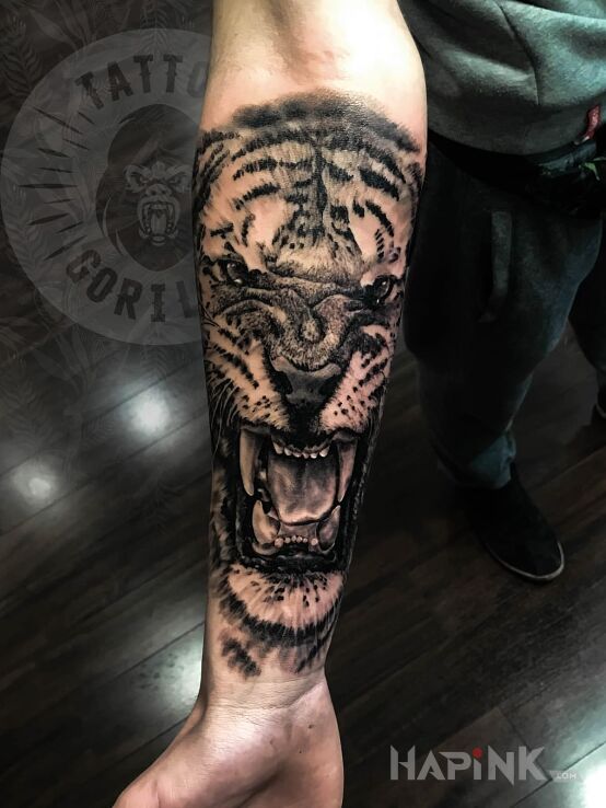 Tattoo Tygrys in animals motif and realistic style on the forearm
