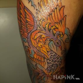 Tattoo Phoenix on the upper arm motif: colorful style: japanese / irezumi
