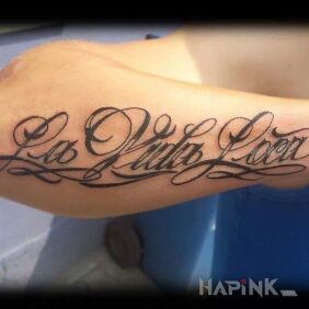 Tattoo La Vida Loca on the forearm motif: lettering
