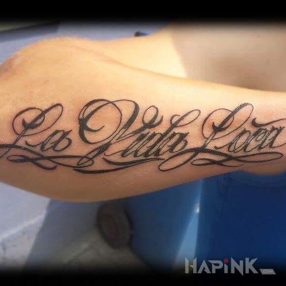 Tattoo La Vida Loca in lettering motif on the forearm