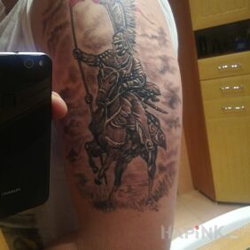 Tattoo Hussar on the upper arm motif: patriotic