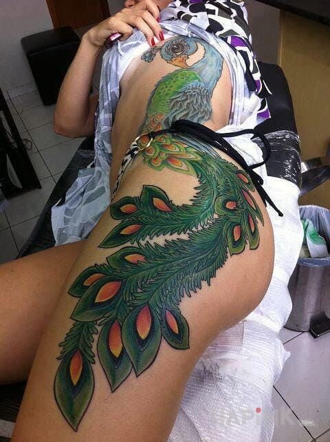 Tattoo Paw in colorful motif on the leg