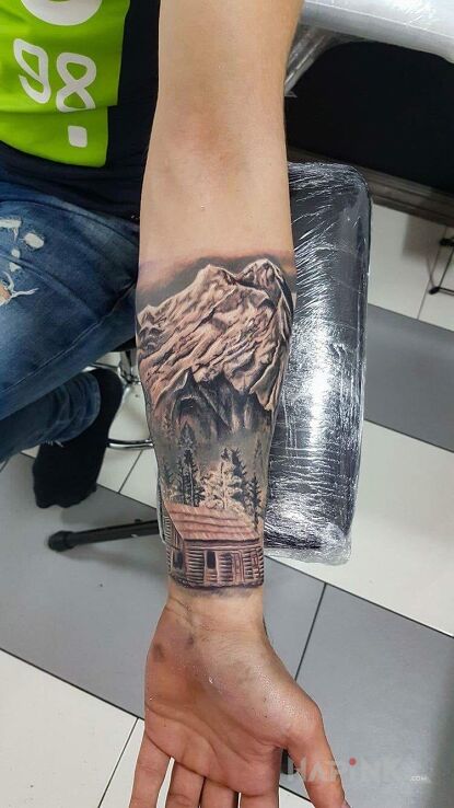 Tattoo Mała oaza w górach in 3D motif and realistic style on the forearm