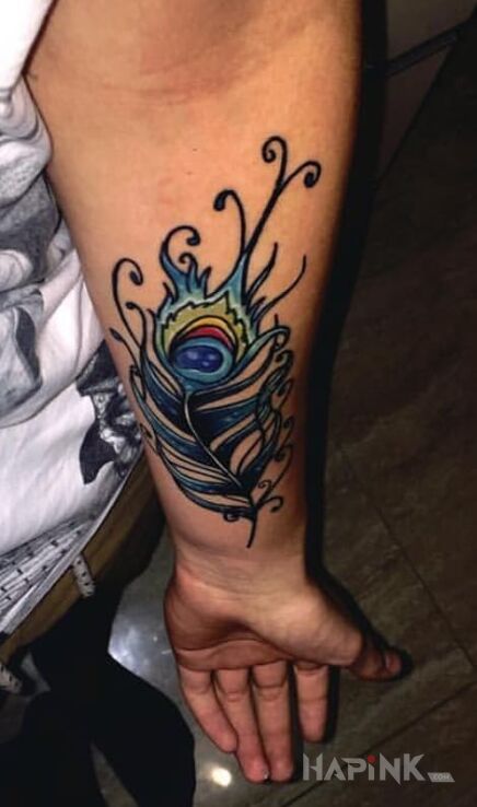 Tattoo Pawie pióro in other motif on the forearm