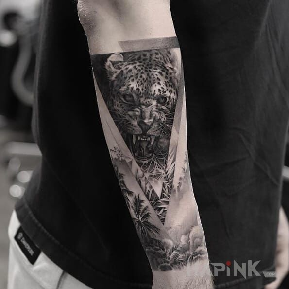 Tattoo Lampart in 3D motif and realistic style on the forearm
